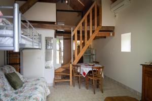 a small room with a table and a staircase at Cabane à Mémé in Cosnac