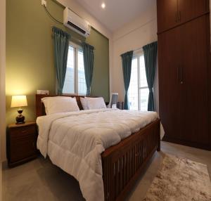 Katil atau katil-katil dalam bilik di Olivette Suites