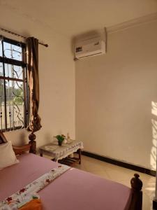 Postel nebo postele na pokoji v ubytování Shalom Homestay + 5 fotografií