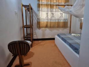 Postel nebo postele na pokoji v ubytování Shalom Homestay
