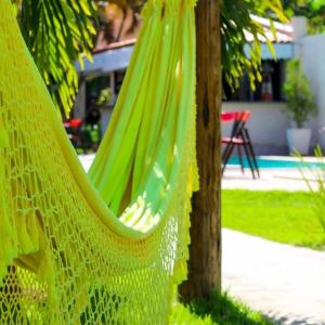 Κήπος έξω από το Apartamento Pé na areia