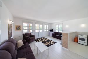 a living room with a couch and a table at Holiday Home Soul 