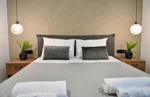 Postel nebo postele na pokoji v ubytování Olivae Mare Suites