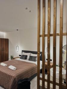 Postel nebo postele na pokoji v ubytování Olivae Mare Suites