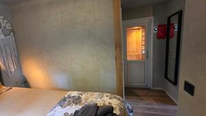 Postel nebo postele na pokoji v ubytování Sfeervol chalet de Dassenburcht