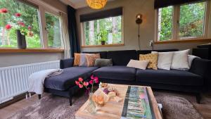 Posezení v ubytování Sfeervol chalet de Dassenburcht