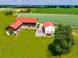 an aerial view of a large house in a field at Strass4 in Neumarkt-Sankt Veit