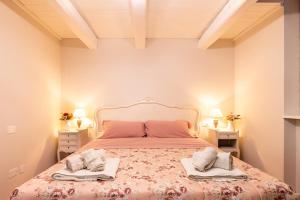 Postel nebo postele na pokoji v ubytování Cottage L'Antico Frantoio