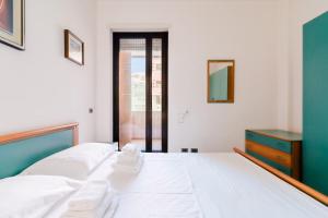 En eller flere senge i et værelse på Appartamentino Vicino al Mare