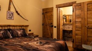 a bedroom with a bed and an open door at Il Ranch Country House B&B in Anagni