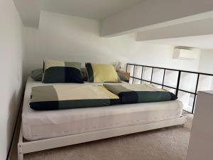a bedroom with a large bed with a metal frame at Biztos Kuckó in Szeged