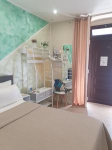 a bedroom with a bed and a book shelf at Corte Verde 5 in Bari