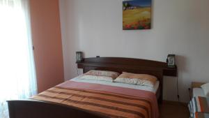 Postel nebo postele na pokoji v ubytování Apartments Tea