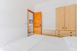 Ένα ή περισσότερα κρεβάτια σε δωμάτιο στο Appartamento Vista Mare