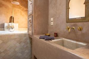 a bathroom with a large tub and a mirror at Dar Maha - Amazing villa -heated pool 15x5M in Essaouira +51 photos