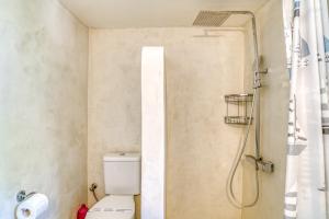 a bathroom with a toilet and a shower at Great house w/ BBQ in Paros in Santa Maria +20 photos