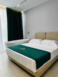 Posteľ alebo postele v izbe v ubytovaní TreA Suites
