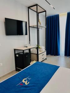 Posteľ alebo postele v izbe v ubytovaní TreA Suites