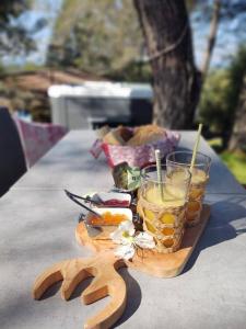 a table with a tray of food and a drink at GITE AVEC SPA JACUZZI au cœur de Provence Côte d'Azur in Saint Antonin du Var +32 photos