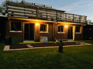 a house with lights on the front of it at Studio Le Prunier in La Plaine des Cafres