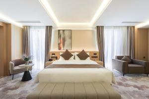Letto o letti in una camera di JD POLMAN Hotel