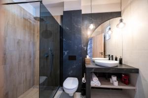 a bathroom with a shower and a toilet and a sink at BoKe Prémium Apartmanok in Szarvas +19 photos