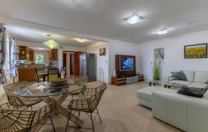 a living room with a couch and a table at Villa Gigi by Villas Guide in Poreč