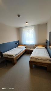 Postel nebo postele na pokoji v ubytování Chmelnice na stezce