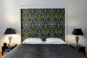Postel nebo postele na pokoji v ubytování Liv'Inn Aparthotel