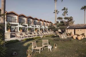 A garden outside Day One Beach Resort & SPA - Adult Only