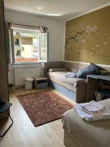 Giường trong phòng chung tại Casa Vacanze da Lilly - GREEN -