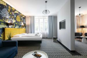 Postel nebo postele na pokoji v ubytování Liv'Inn Aparthotel