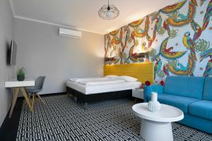 Postel nebo postele na pokoji v ubytování Liv'Inn Aparthotel