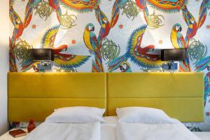 Postel nebo postele na pokoji v ubytování Liv'Inn Aparthotel