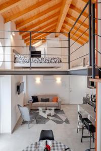 a living room with a couch and a table at Casa Quadrifoglio - Ticino in Intra