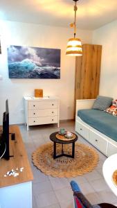 a living room with a bed and a coffee table at Bonaca Apartments in Budva