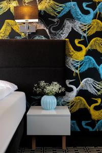 Postel nebo postele na pokoji v ubytování Liv'Inn Aparthotel