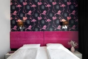 Postel nebo postele na pokoji v ubytování Liv'Inn Aparthotel