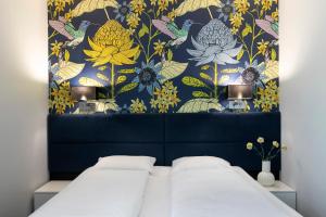 Postel nebo postele na pokoji v ubytování Liv'Inn Aparthotel