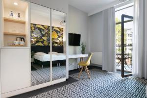 TV a/nebo společenská místnost v ubytování Liv'Inn Aparthotel