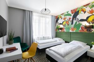 Postel nebo postele na pokoji v ubytování Liv'Inn Aparthotel