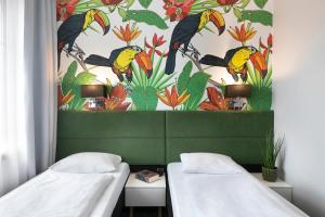 Postel nebo postele na pokoji v ubytování Liv'Inn Aparthotel