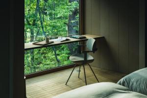 a room with a desk and a chair in front of a window at SANU 2nd Home 河口湖2nd in Fujikawaguchiko