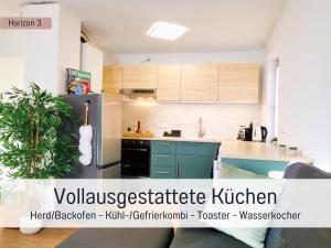 Η κουζίνα ή μικρή κουζίνα στο Newman Horizon Apartments Zirndorf - Playmobil Funpark, Nähe Messe Nürnberg und Fürth, 4 Pers, 24h Self Checkin, Waschmaschine, großer Parkplatz