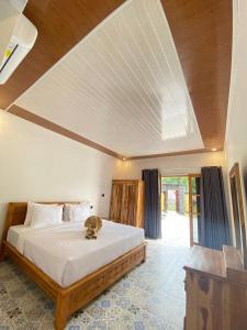 Postel nebo postele na pokoji v ubytování SUN RESORT GILI TRAWANGAN