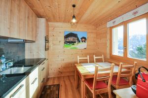 Kuchyň nebo kuchyňský kout v ubytování Appartement La Manna + 18 fotografií