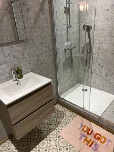 a bathroom with a shower and a white sink and a shower at La Maison du Coeur Calme in Cancon +23 photos
