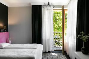 Postel nebo postele na pokoji v ubytování Liv'Inn Aparthotel
