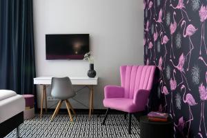 TV a/nebo společenská místnost v ubytování Liv'Inn Aparthotel