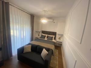 Postel nebo postele na pokoji v ubytování Apartment and rooms EL